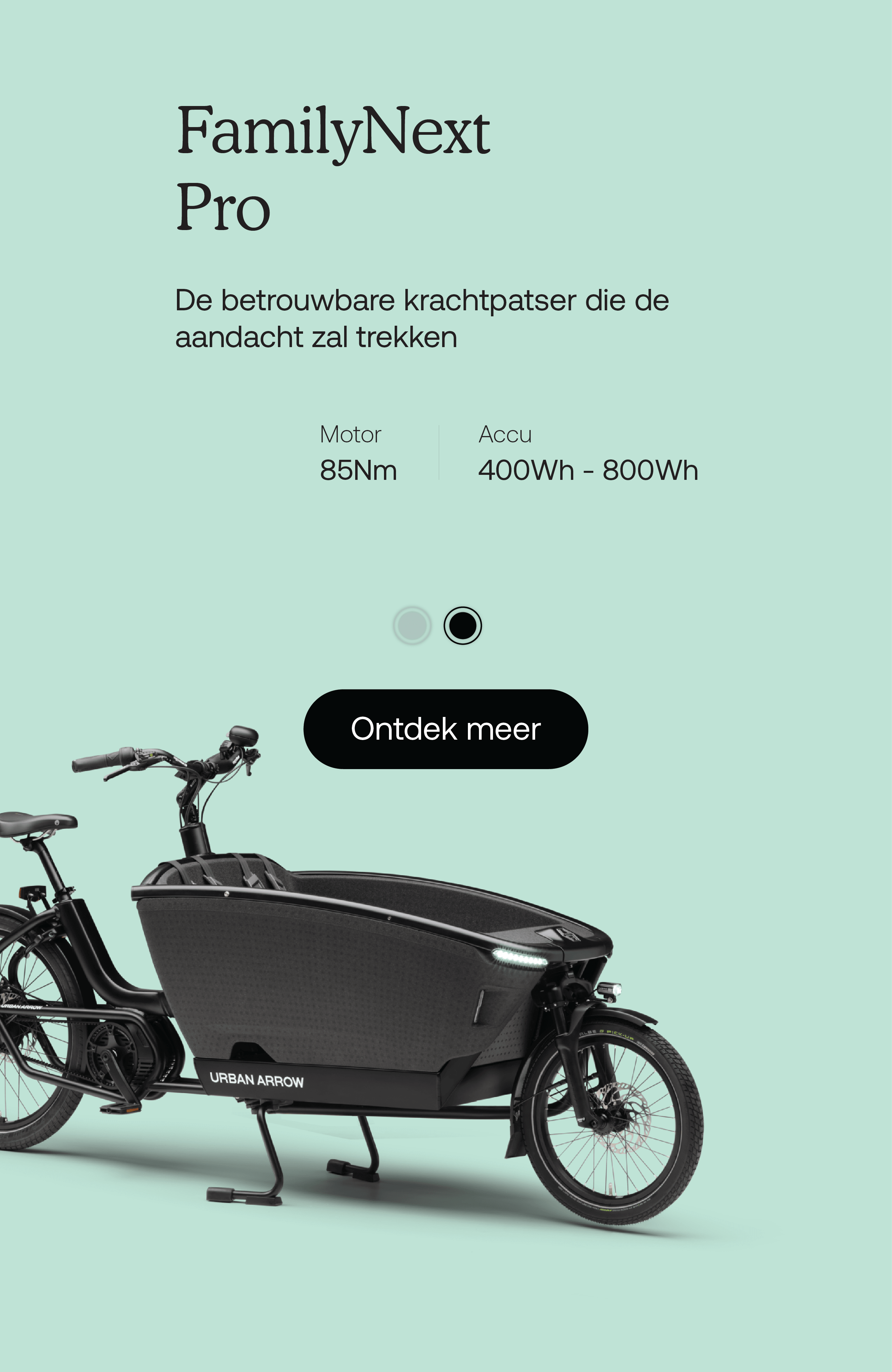 A sleek, modern cargo bike with a black frame on a light green background. Text above reads FamilyNext Pro in Dutch, highlighting motor power as 85Nm and battery capacity as 545Wh. Button below says Ontdek meer.